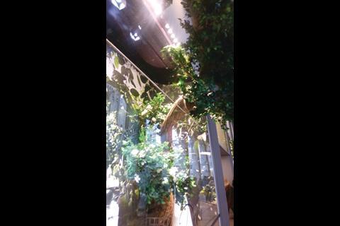 An inside-out window treatment of the kind that demonstrates that physical barriers needn’t present quite the sort of impediment that many visual merchants seem to think they do